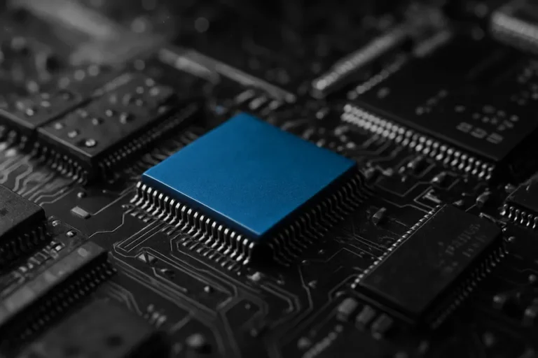 Close-up view of integrated circuits and microchips on a circuit board, showcasing technological details.